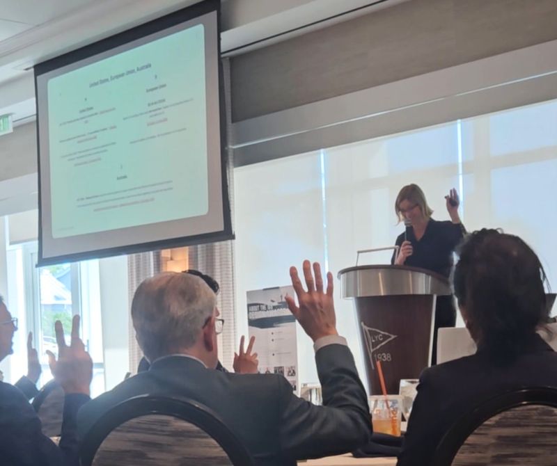 Kristina Agustin delivering presentation at podium